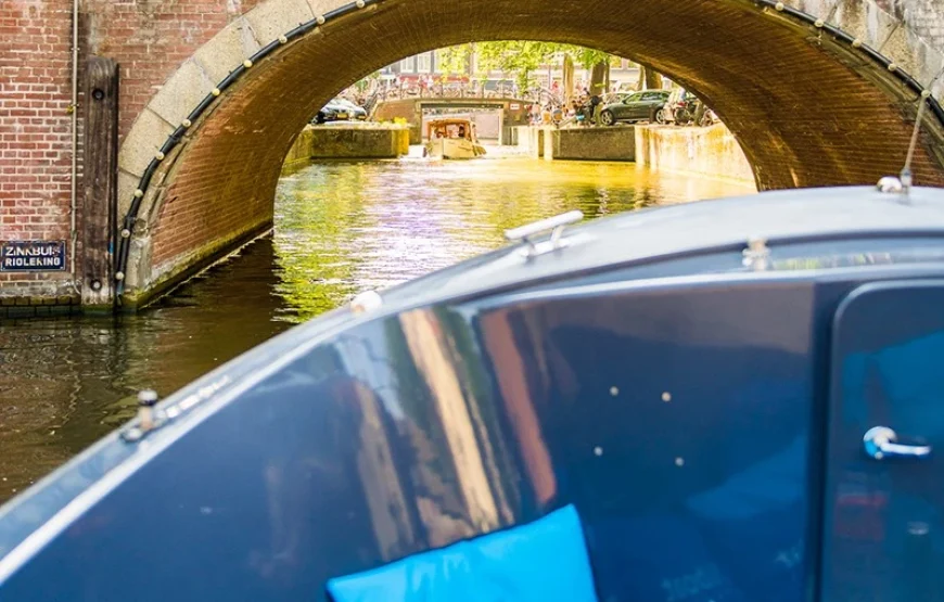 Cruise like a local in an open boat in Amsterdam Depart near Central Station